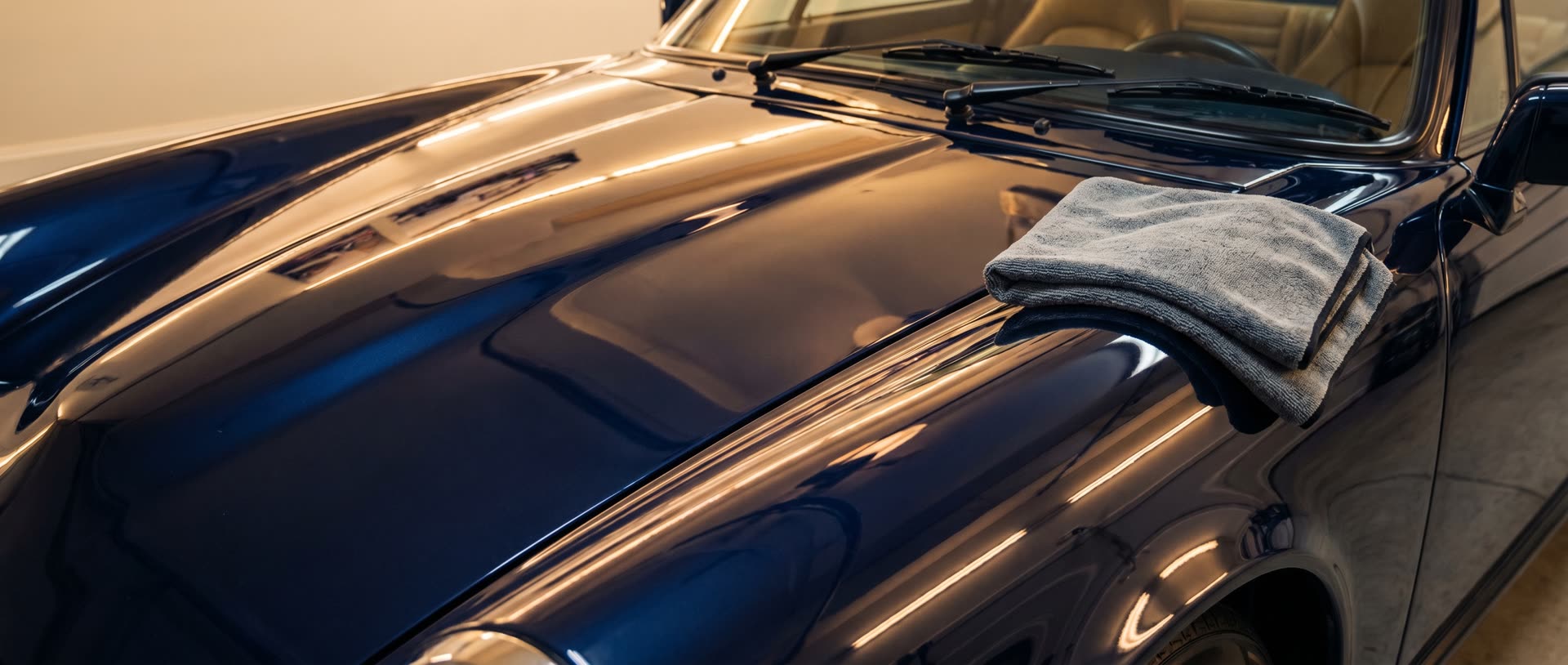 Dull, swirled navy paint before correction