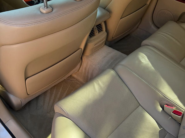 Spotless tan leather rear interior after detailing